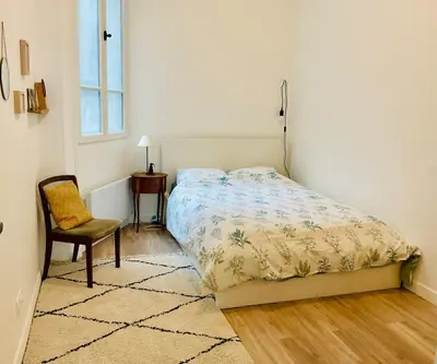 Un ou plusieurs lits dans un hébergement de l'établissement Appartement cosy et familial Paris
