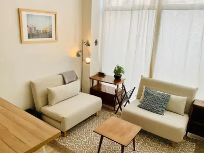Coin salon dans l'établissement Appartement cosy et familial Paris