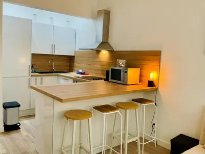 Cuisine ou kitchenette dans l'établissement Appartement cosy et familial Paris