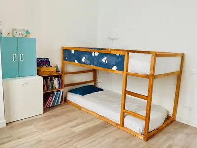 Un ou plusieurs lits dans un hébergement de l'établissement Appartement cosy et familial Paris
