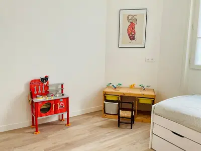 Un ou plusieurs lits dans un hébergement de l'établissement Appartement cosy et familial Paris