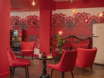 Coin salon dans l'établissement Hôtel Exquis