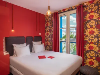 Un ou plusieurs lits dans un hébergement de l'établissement Hôtel Exquis