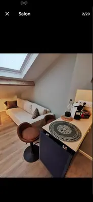 Coin salon dans l'établissement Studio Courbevoie gare La Défense tout équipé !