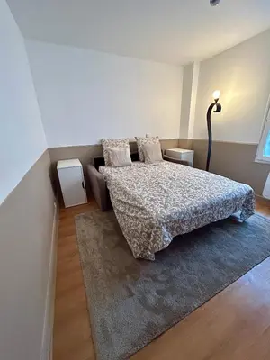 Un ou plusieurs lits dans un hébergement de l'établissement Studio aux Portes de Paris