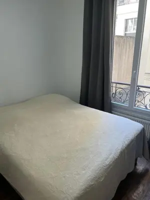 Un ou plusieurs lits dans un hébergement de l'établissement Appartement Ternes - Arc de Triomphe