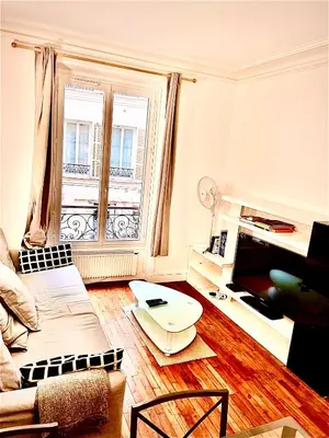 Télévision ou salle de divertissement dans l'établissement Appartement Ternes - Arc de Triomphe