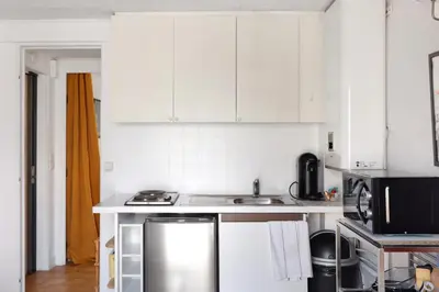 Cuisine ou kitchenette dans l'établissement BM Face au SacreCoeur Escapade a deux