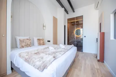 Un ou plusieurs lits dans un hébergement de l'établissement Stylish Duplex in Paris' Center