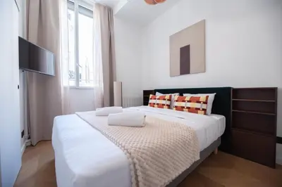 Un ou plusieurs lits dans un hébergement de l'établissement Stylish Duplex in Paris' Center