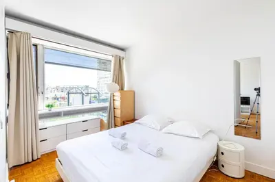 Un ou plusieurs lits dans un hébergement de l'établissement GuestReady - Tranquil city stay near Montparnasse