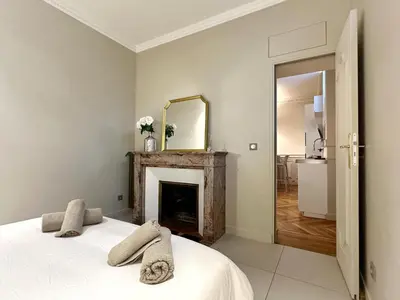 Un ou plusieurs lits dans un hébergement de l'établissement Celine 24 Le Flandrin Haussmann, Appart spacieux dans le 16e