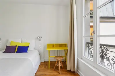 Un ou plusieurs lits dans un hébergement de l'établissement Escapade élégante dans le Marais