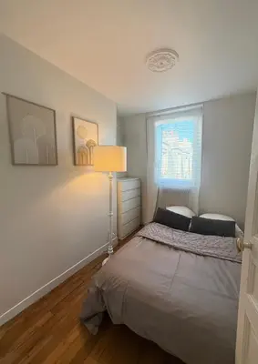 Un ou plusieurs lits dans un hébergement de l'établissement New Apprt 2 Rooms Tour Eiffel