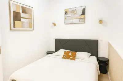 Un ou plusieurs lits dans un hébergement de l'établissement Appartement atypique avec Mezzanine - Paris 9 - 6P