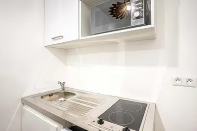 Cuisine ou kitchenette dans l'établissement Appartement 07 - Paris Faubourg Bail Mobilité