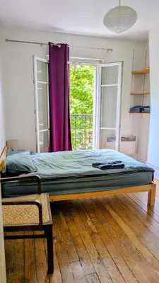 Un ou plusieurs lits dans un hébergement de l'établissement Classic Parisian 2 BR flat in Paris 10