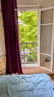 Un ou plusieurs lits dans un hébergement de l'établissement Classic Parisian 2 BR flat in Paris 10
