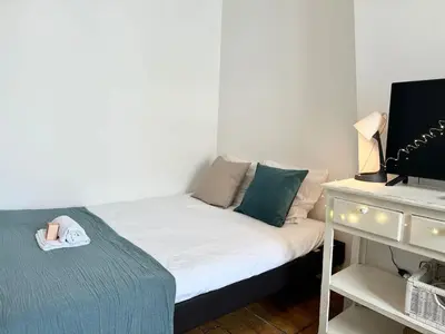 Un ou plusieurs lits dans un hébergement de l'établissement New 702 Suite Piscine - Cosy Apartment Paris Center