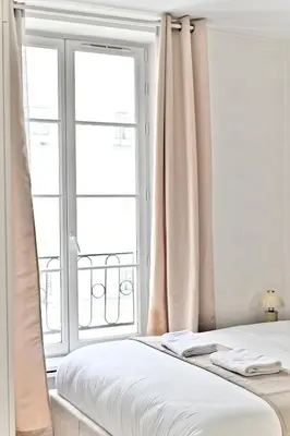 Un ou plusieurs lits dans un hébergement de l'établissement Élégant appartement 2 chambres - Luxembourg