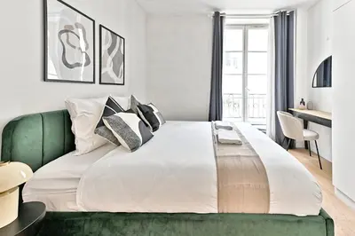 Un ou plusieurs lits dans un hébergement de l'établissement Élégant appartement 2 chambres - Luxembourg