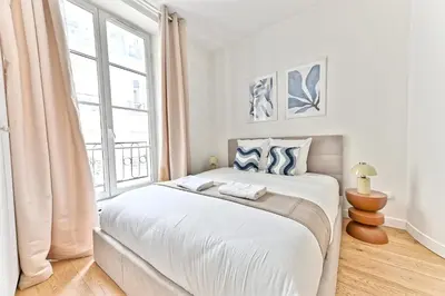 Un ou plusieurs lits dans un hébergement de l'établissement Élégant appartement 2 chambres - Luxembourg
