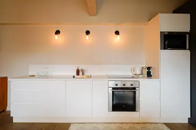 Cuisine ou kitchenette dans l'établissement Grand appartement cœur du Marais - dernier étage