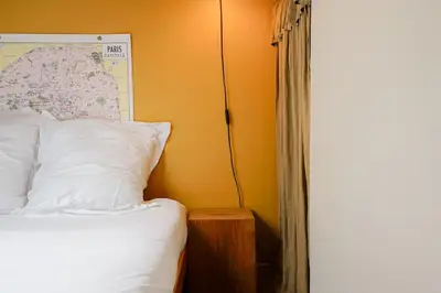 Un ou plusieurs lits dans un hébergement de l'établissement Grand appartement cœur du Marais - dernier étage