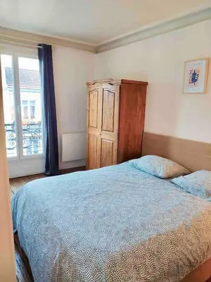 Un ou plusieurs lits dans un hébergement de l'établissement 2 rooms, close to Montmartre, light and quiet