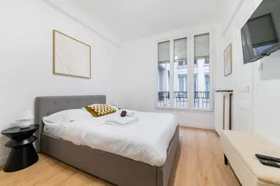Un ou plusieurs lits dans un hébergement de l'établissement Studio elegant sacre coeur metro anvers - Paris 18 -2P