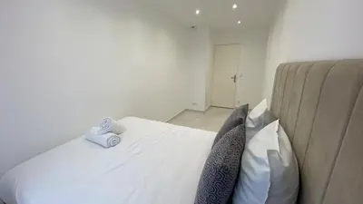Un ou plusieurs lits dans un hébergement de l'établissement Appartement La Défense 10P