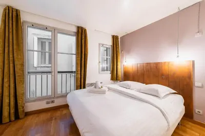 Un ou plusieurs lits dans un hébergement de l'établissement Appartement Spacieux Face aux Jardins des plantes