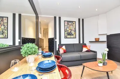 Coin salon dans l'établissement Cosy appartment 1BR 4P Place des Vosges