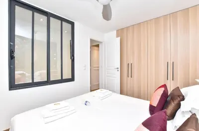 Un ou plusieurs lits dans un hébergement de l'établissement Cosy appartment 1BR 4P Place des Vosges
