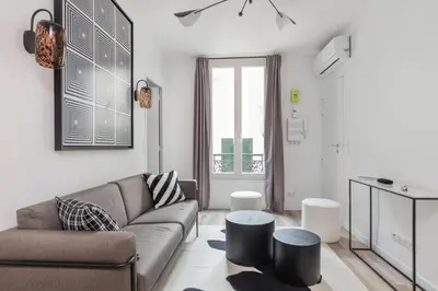 Coin salon dans l'établissement Superbe appartement cosy et design Paris 17