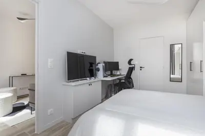Un ou plusieurs lits dans un hébergement de l'établissement Superbe appartement cosy et design Paris 17