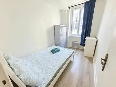 Un ou plusieurs lits dans un hébergement de l'établissement Heart of Paris Apartment