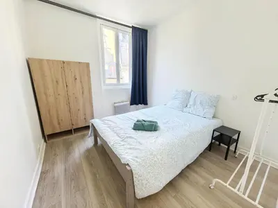 Un ou plusieurs lits dans un hébergement de l'établissement Heart of Paris Apartment