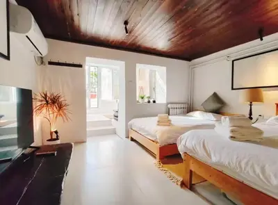 Un ou plusieurs lits dans un hébergement de l'établissement Cozy Studio Paris 14e