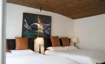 Un ou plusieurs lits dans un hébergement de l'établissement Cozy Studio Paris 14e