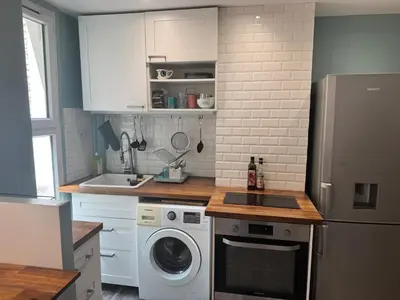Cuisine ou kitchenette dans l'établissement Charmant T2 calme, à 15 min du cœur de Paris
