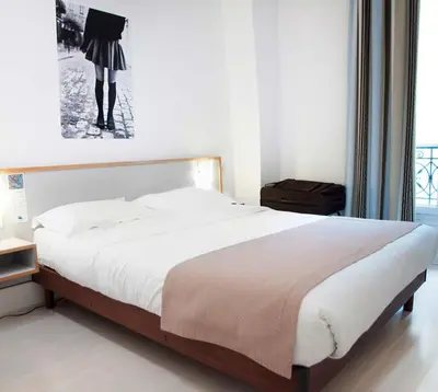 Un ou plusieurs lits dans un hébergement de l'établissement Solar Hotel