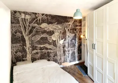Un ou plusieurs lits dans un hébergement de l'établissement appartement d'artiste