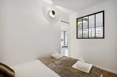 Un ou plusieurs lits dans un hébergement de l'établissement Magnifique appartement luxueux au coeurs de Paris