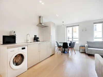 Cuisine ou kitchenette dans l'établissement Cosy apartment in Sentier