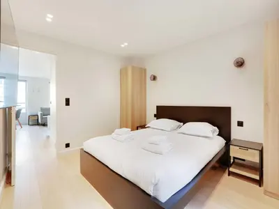 Un ou plusieurs lits dans un hébergement de l'établissement Cosy apartment in Sentier
