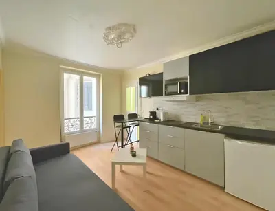Cuisine ou kitchenette dans l'établissement Cozy appart 15Mn Champs-Élysées