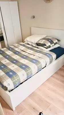 Un ou plusieurs lits dans un hébergement de l'établissement Cozy appart 15Mn Champs-Élysées