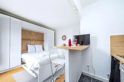 Un ou plusieurs lits dans un hébergement de l'établissement Studio cosy et équipé Paris 17 - II