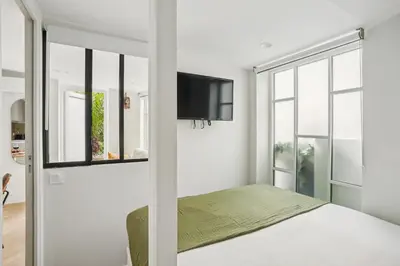 Un ou plusieurs lits dans un hébergement de l'établissement Lavie Maison AC and Terrace